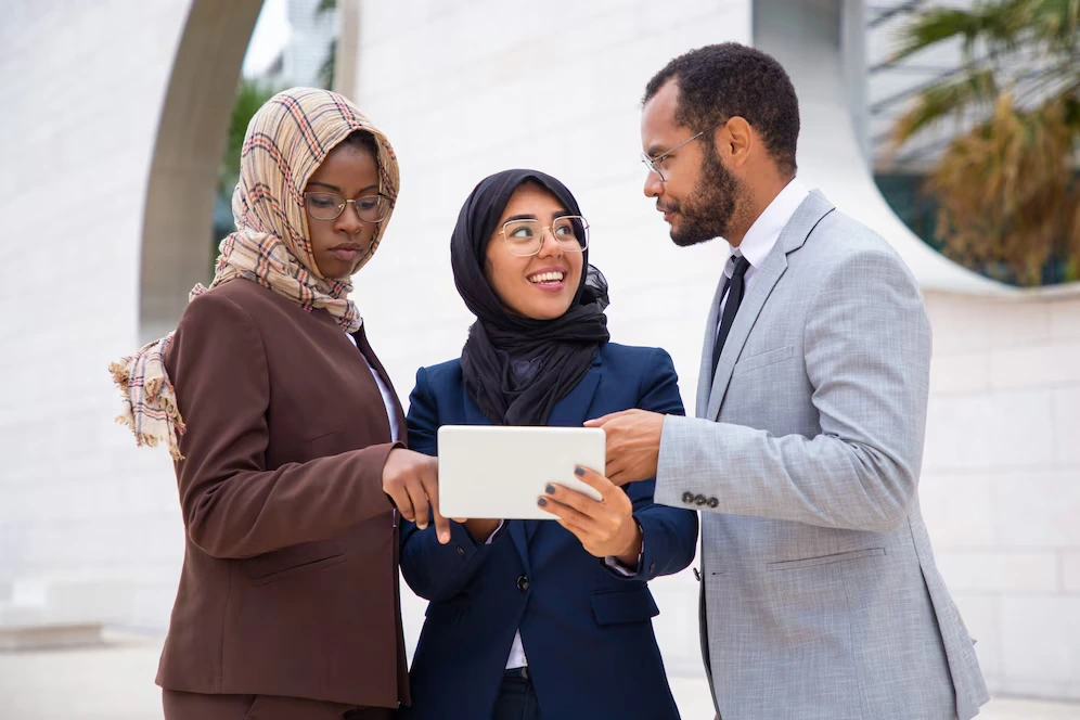 Professional team explaining why to choose their Eid ul Adha corporate event planning services in the UK.